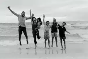 Jeff and Mandy Rose with Family on beach for vacation