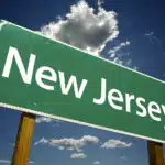 New Jersey Road Sign with dramatic clouds and sky.